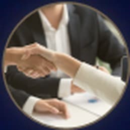 Two people shaking hands after a meeting